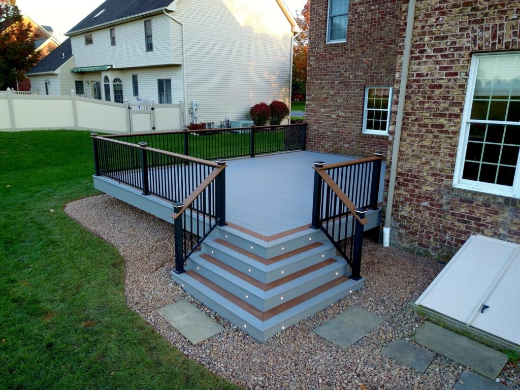 Schrom - Keylink Chesapeake railing, Wolf Lighting, Cottage decking with Cabin highlights and rail decking