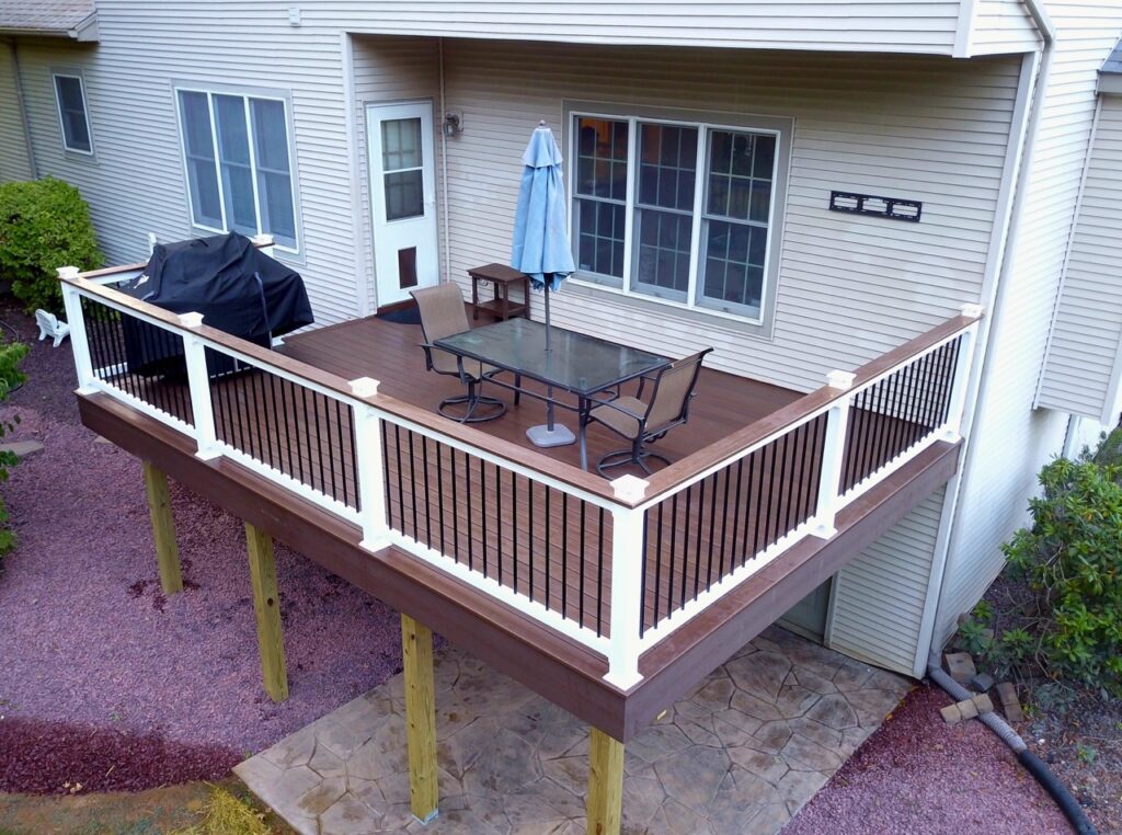 Wolfe - Superior 400 series railing with York balusters, Wolf lighting, Fiberon Espresso decking