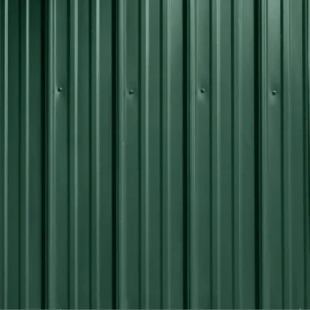 Green corrugated metal wall with vertical ridges (industrial siding)